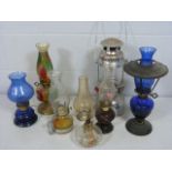 Lovely selection of coloured glass oil lamps to include Bristol Blue glass, end of day style glass