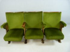 Three Folding 20th century Cinema theatre seats with cast iron ends and green Velour upholstery.