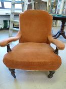Antique open arm red upholstered bedroom chair on castors