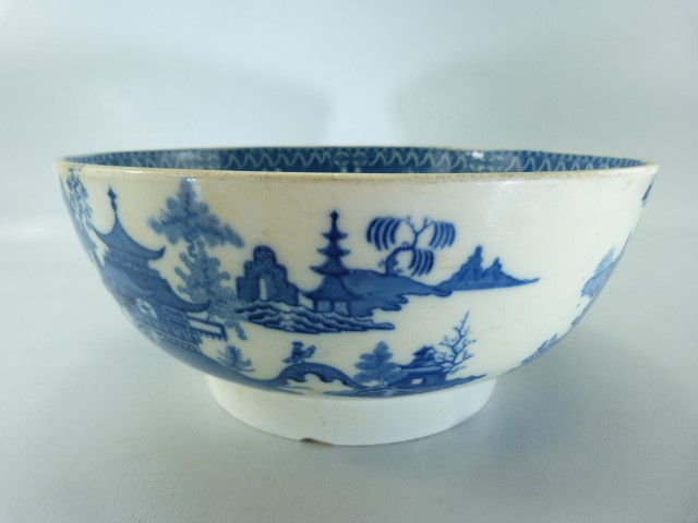 Pearlware blue and white bowl decorated with oriental scenes