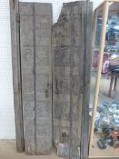 Two Antique carved Indian hardwood door panels. Carvings of a primitive form including Birds, men,