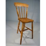 Childs punishment type chair with high stick back and long legs.