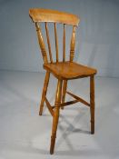 Childs punishment type chair with high stick back and long legs.