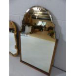 Arts and crafts shaped mirror with partial carved wooden frame