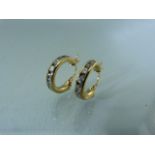 Pair of 9ct CZ loop earrings