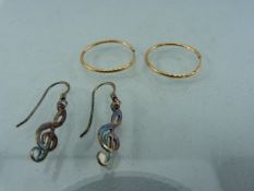 Sterling silver musical note earrings and a pair of Gold hoops