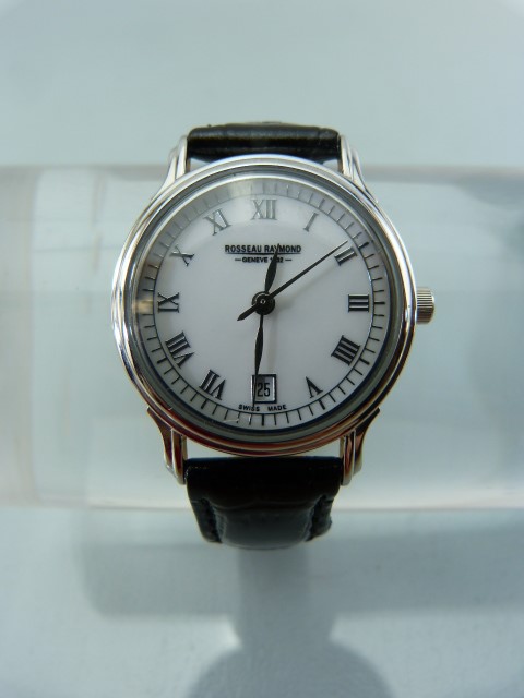 Rosseau Raymond ladies wrist watch. Off White face with silver tone Roman Numeral chapter ring.