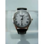 Rosseau Raymond ladies wrist watch. Off White face with silver tone Roman Numeral chapter ring.