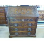 Greenman Oak carved Bureau with various drawers