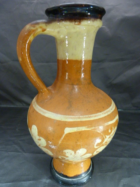 Slipware terracotta colour jug with red and cream decoration in the form of simplistic flowers, - Image 2 of 5