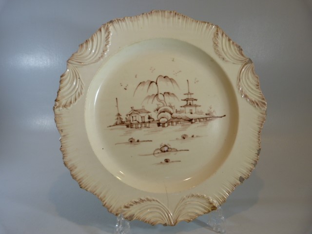 18th Century Leeds pearl ware plate with feather moulded edging. Decorated to central panel with