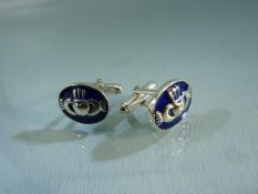 Hallmarked silver cufflinks set with welsh style enamel panels