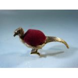 Copper pin cushion in the form of a pheasant