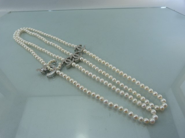 Designer style long row of Pearls set with CZ clasps