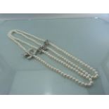 Designer style long row of Pearls set with CZ clasps