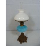 Oil Lamp with frosted shade and clear chimney and blue glass well, moulded with scrolls. Standing on