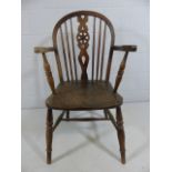 19th Century Wheel back elbow chair of elm and ash.