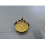 1914 Half Sovereign Coin Pendant, with scroll work and bale soldered to the top on the coin.