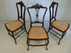 Set of three 19th Century mahogany french chairs with rococo scrolls motif to top and pierced