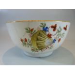 Staffordshire creamware slops bowl decorated with scallop shells and flora. Red painted mark to