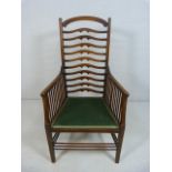 Mahogany ladderback side chair with spindle arms. Unusual shaped splats to back.