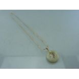 Hallmarked silver chinese style pendant. Pendant set with light coloured Jade ring on a ball