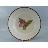 Early Wedgwood handpainted flora plate 'Lady Slipper Orchid' With red enamel to back. Slight loss to