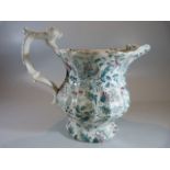 Staffordshire 'Chintz' decorated jug with lion finial to handle