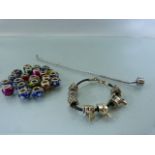 Small collection of approx 22 Pandora style beads with a Pandora style rope bracelet. Along with one