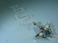 Silver (925) pendant in the form of a bug set with Opal wings and Ruby Thorax.