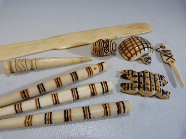 Carved bone African pendants, paper knife etc - Image 2 of 5