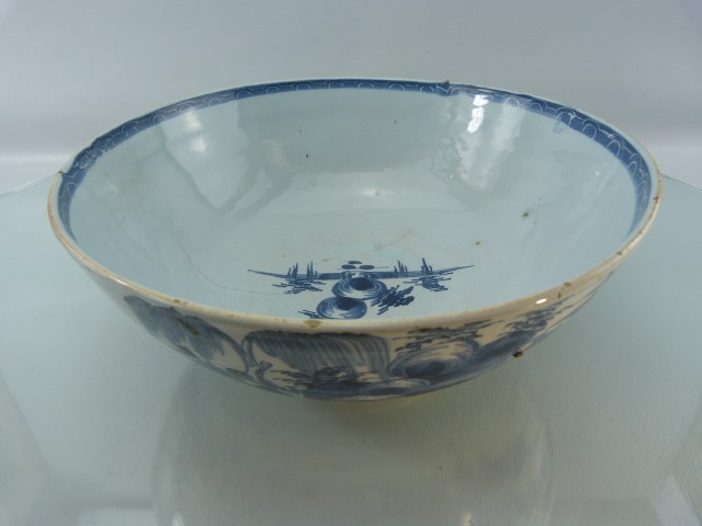 George III Delft bowl - in blue and white. Small hairline to inner bowl and nibbles to base