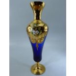 Late Victorian glass goblet in blue with Gilt Overlay and handpainted floral decoration. On a