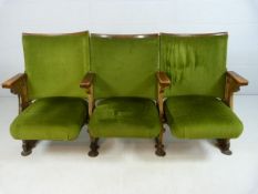 Three Folding 20th century Cinema theatre seats with cast iron ends and green Velour upholstery.