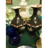 Pair of Edwardian black ground mantelpiece vases,