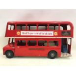 A Tri-ang tinplate double decker bus with Shell advertising to both sides.