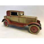 A clockwork tinplate model of a vintage motor car, stamped: Made in Germany JDN.