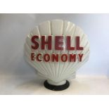 A Shell Economy glass petrol pump globe by Hailware, some chipping to the neck under the rubber