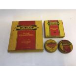 Two Dunlop insulating tape tins, one with contents, a Dunlop pump connection in original box and a