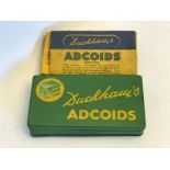 A Duckham's Adcoids rectangular tin with some tablet contents and a Duckham's Adcoids rectangular