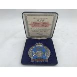 A limited edition RAC Queen's Silver Jubilee badge 1952-1977 numbered, in presentation case.