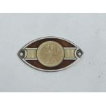 A hallmarked silver oval enamel St. Christopher dashboard plaque.