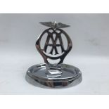 An AA showroom ashtray with plain central badge, chrome plated.