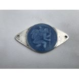 A sterling silver and pale blue enamel St. Christopher dashboard plaque.