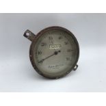 A Cooper Stewart of London silver faced 0-70mph speedometer.