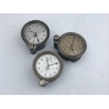 Three Smiths silver faced eight day car clocks, all front wind.