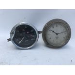 A Smiths black faced 0-60mph speedometer and a Smiths eight day car clock.