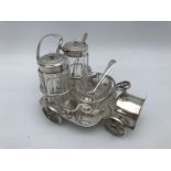 A good quality EPNS novelty table top cruet in the form of a veteran motor car, to move the