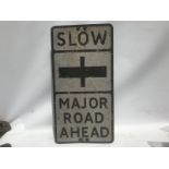 A 'Slow Major Road Ahead' rectangular road sign, 14 x 27 1/2".