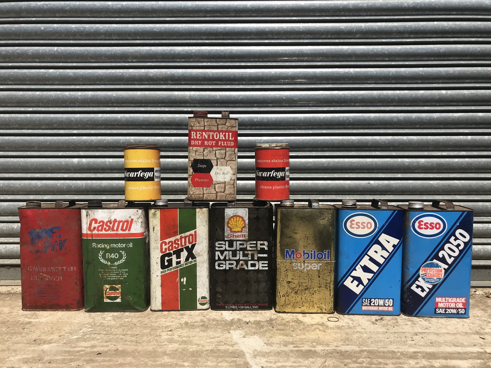 A selection of assorted gallon cans etc. including Castrol and Esso.